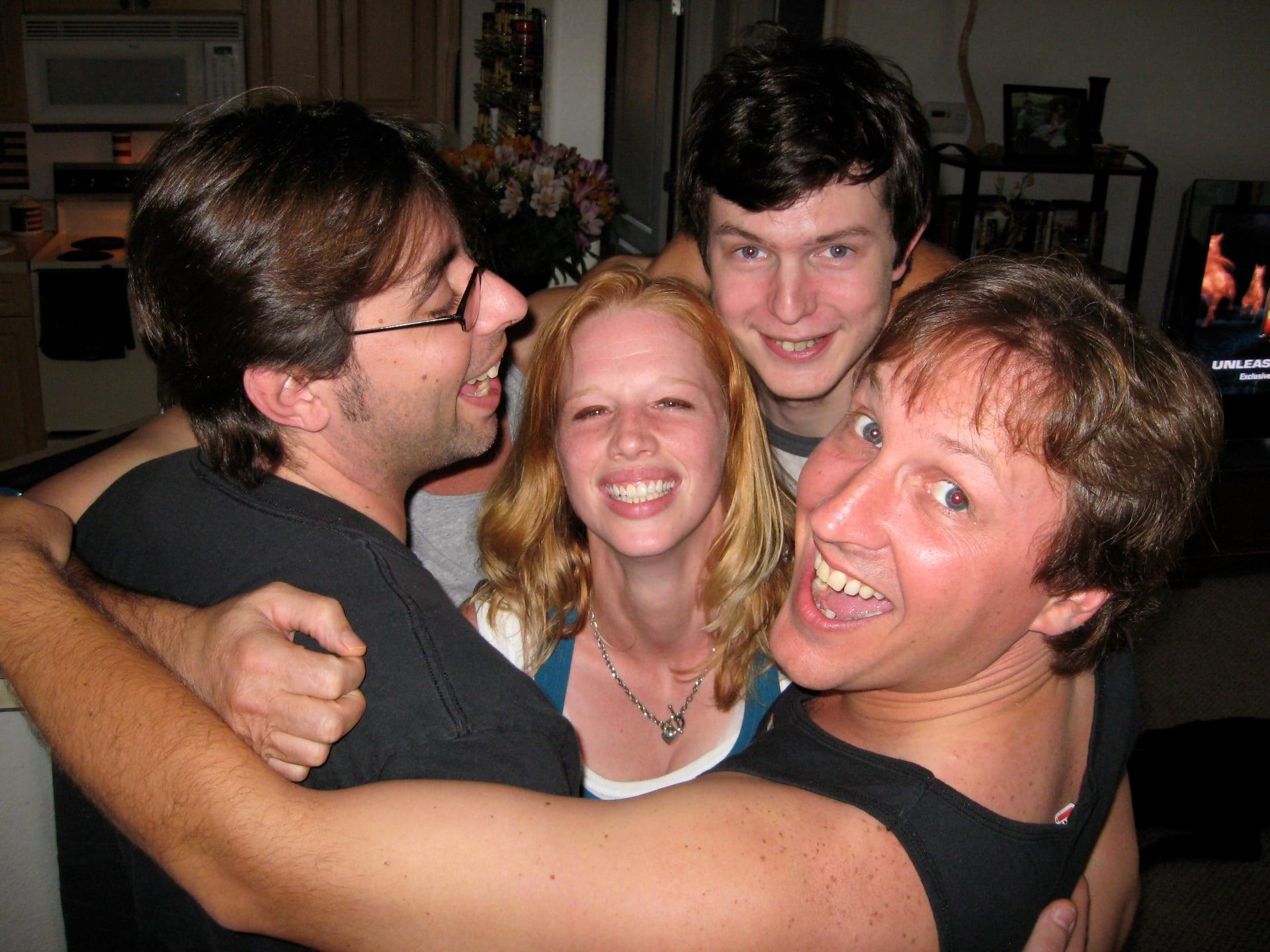 Group of friends hugging and smiling