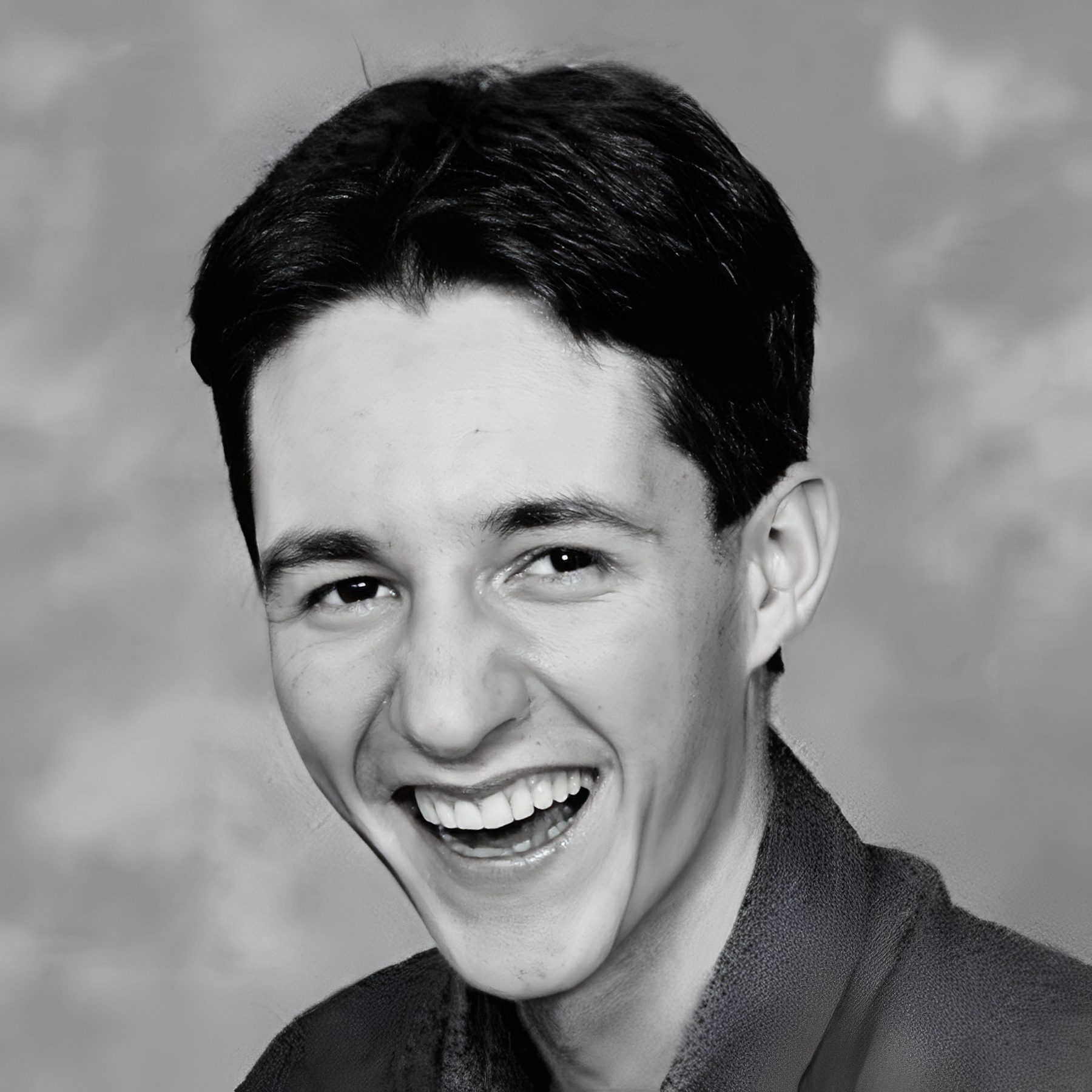 Smiling young man studio portrait