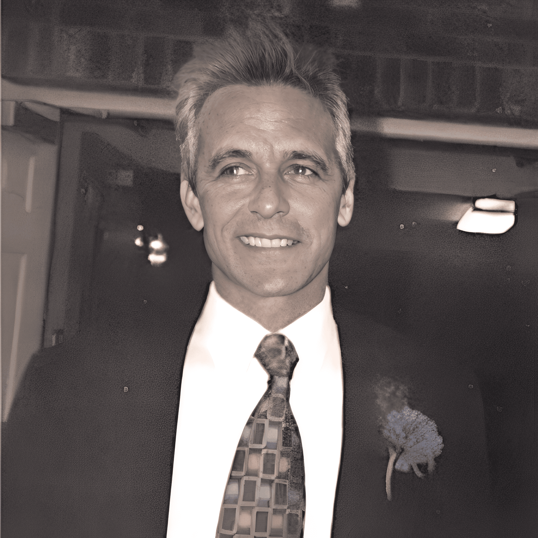 Smiling man in suit with boutonniere
