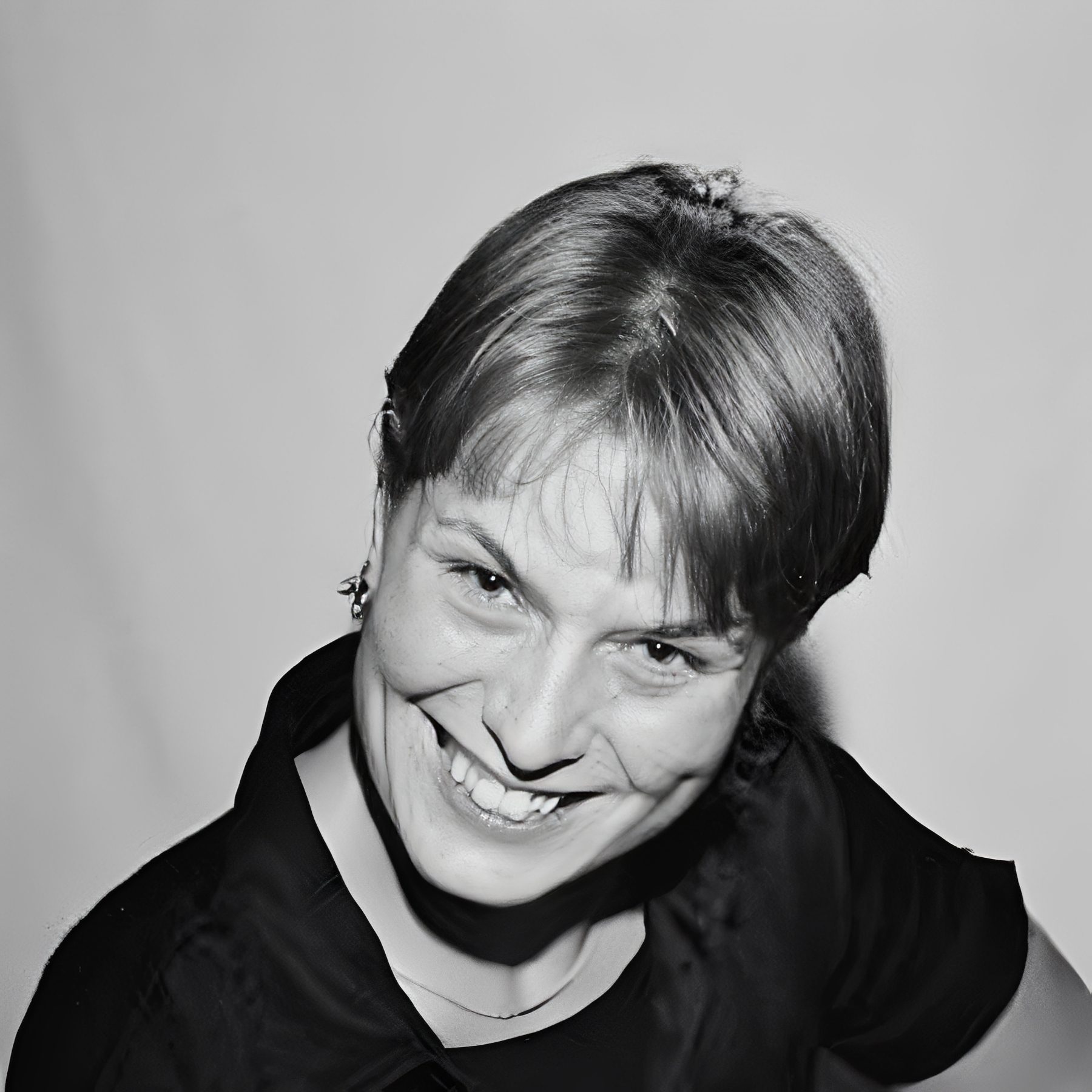 Black-and-white portrait of smiling woman