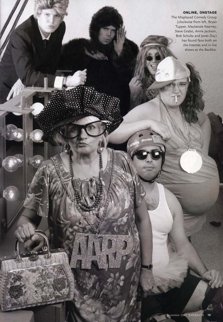 Group of adults in eccentric backstage costumes