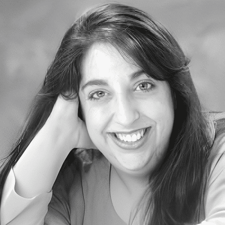 Smiling woman resting her head on hand